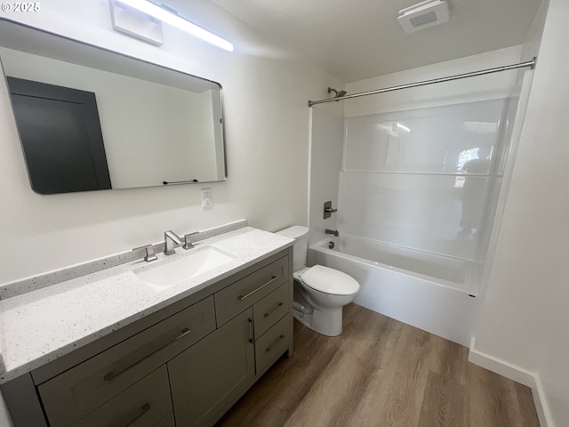 1801 Jackson Ave, La Grande, OR 97850 - bathroom with wood finished floors, toilet, vanity, and tub / shower combination