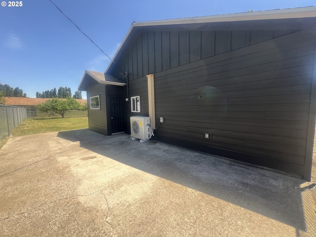 1801 Jackson Ave, La Grande, OR 97850 - view of property exterior with ac unit, board and batten siding, and a patio