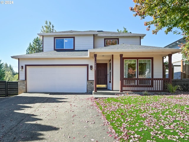 view of front of house featuring covered porch and a garage