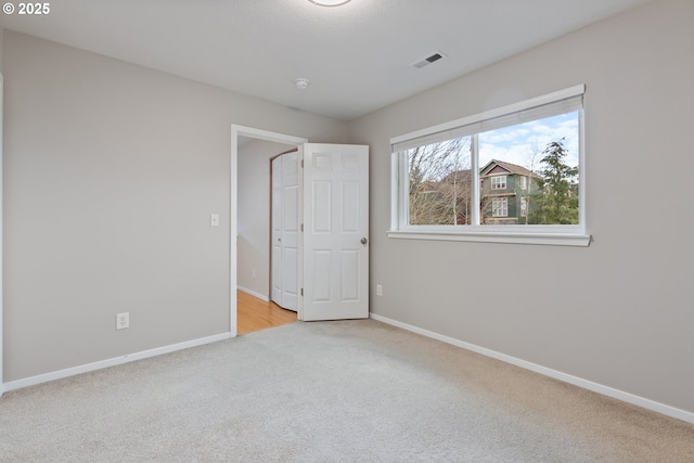 unfurnished bedroom with light carpet