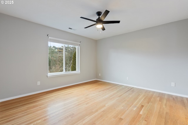 spare room with ceiling fan and light hardwood / wood-style flooring