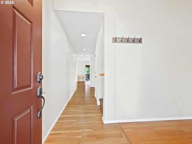 hall with light hardwood / wood-style floors