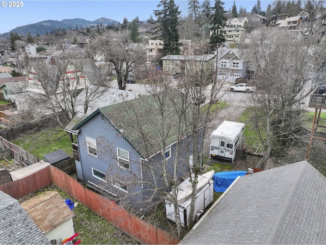 birds eye view of property with a residential view and a mountain view