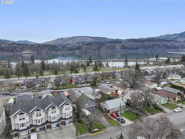 bird's eye view featuring a residential view and a water and mountain view