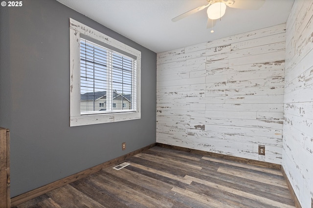 20694 SW Parker Ct, Beaverton, OR 97078 - empty room featuring wooden walls, dark wood-style flooring, and ceiling fan