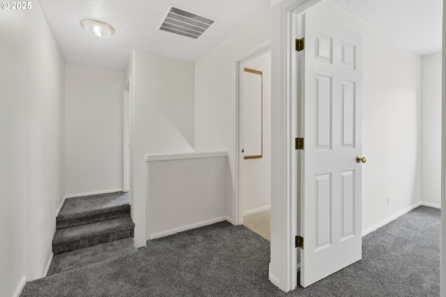 3617 Westleigh St, Eugene, OR 97405 - hallway featuring dark colored carpet and baseboards