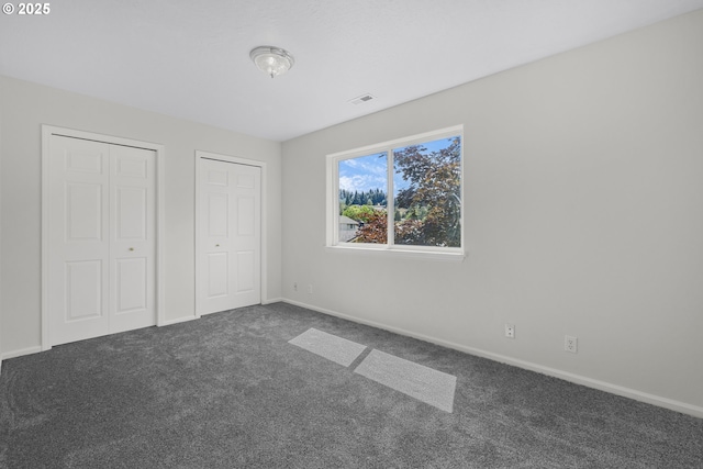 3617 Westleigh St, Eugene, OR 97405 - unfurnished bedroom featuring carpet and multiple closets