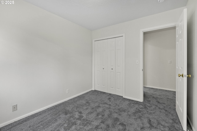 3617 Westleigh St, Eugene, OR 97405 - unfurnished bedroom featuring dark carpet and a closet