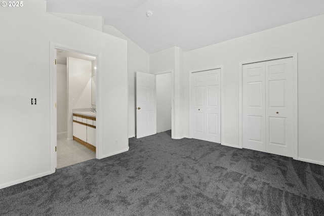 3617 Westleigh St, Eugene, OR 97405 - unfurnished bedroom featuring multiple closets, carpet, and lofted ceiling