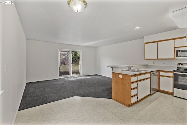 3617 Westleigh St, Eugene, OR 97405 - kitchen featuring stainless steel appliances, a peninsula, light countertops, open floor plan, and white cabinets