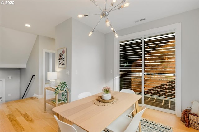 dining area with an inviting chandelier, recessed lighting, light wood finished floors, and visible vents