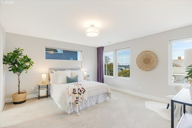 bedroom featuring carpet floors and baseboards