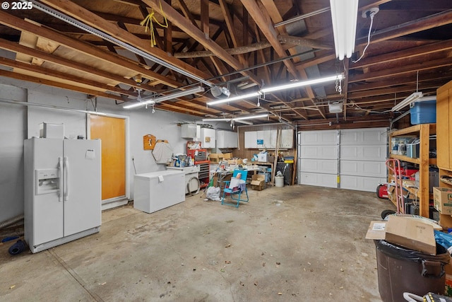 808 E 14th St, Coquille, OR 97423 - garage featuring white fridge with ice dispenser, fridge, and a garage door opener