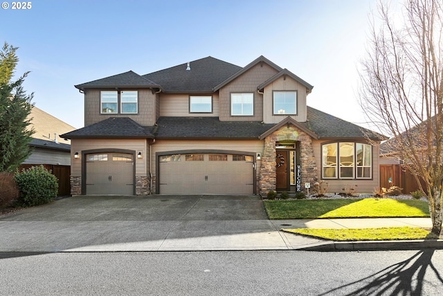 view of front of property featuring a garage and a front lawn