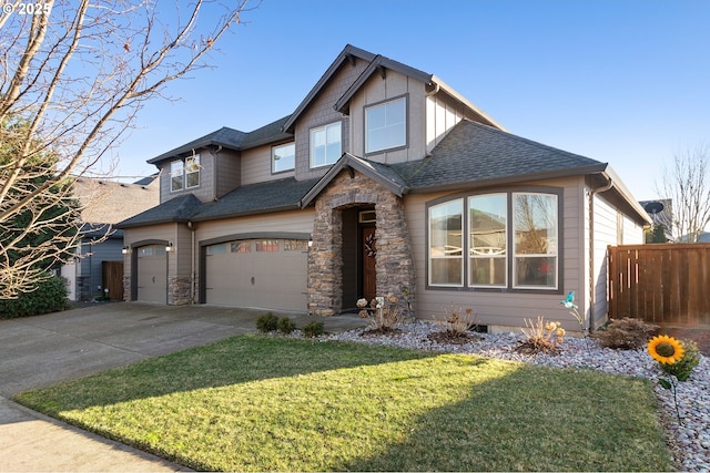 view of front of home featuring a garage and a front yard