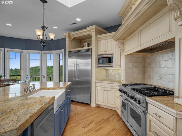 9320 NW Skyview Ct, Portland, OR 97231 - kitchen with built in appliances, a sink, blue cabinets, open shelves, and recessed lighting