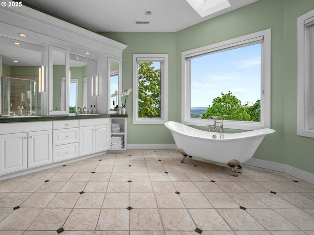 9320 NW Skyview Ct, Portland, OR 97231 - bathroom with baseboards, a soaking tub, tile patterned floors, a shower stall, and vanity