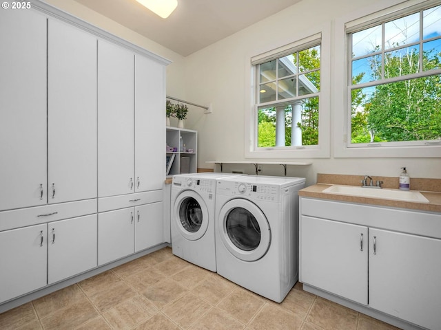 9320 NW Skyview Ct, Portland, OR 97231 - laundry room featuring cabinet space and separate washer and dryer
