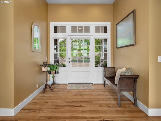 9320 NW Skyview Ct, Portland, OR 97231 - doorway to outside with baseboards and light wood-style floors