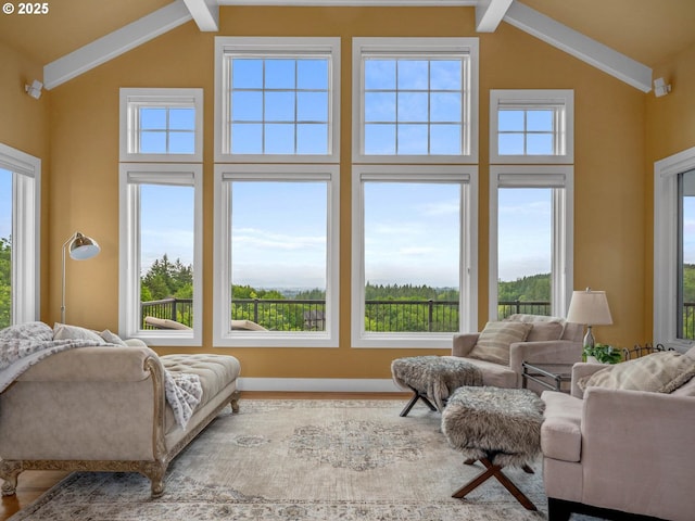 9320 NW Skyview Ct, Portland, OR 97231 - living room featuring high vaulted ceiling, beam ceiling, plenty of natural light, and wood finished floors