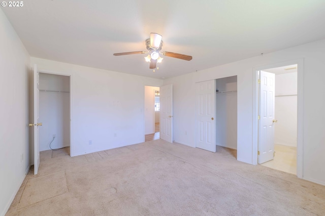 unfurnished bedroom featuring a closet, ceiling fan, and carpet flooring