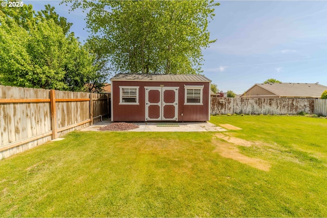 view of shed with a fenced backyard