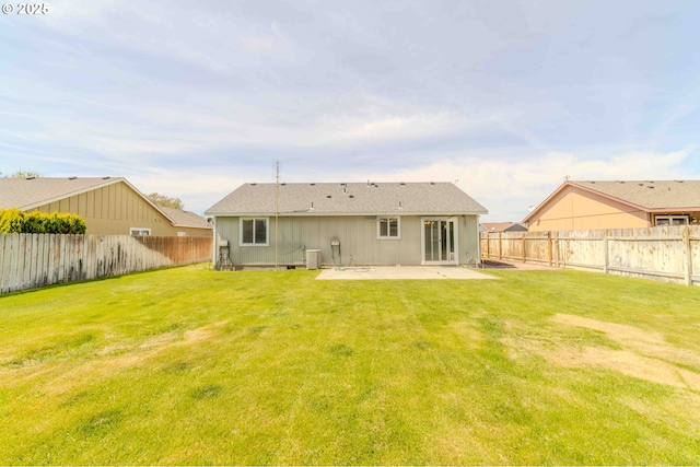 back of property featuring a patio, a fenced backyard, and a lawn