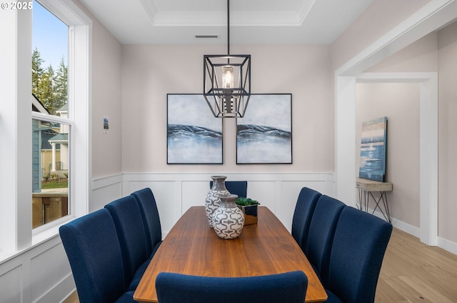 17716 NW Layla Dr Lot 28, Portland, OR 97229 - dining space with a chandelier, light wood-style floors, a tray ceiling, crown molding, and wainscoting