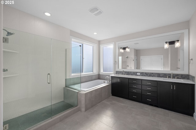 17716 NW Layla Dr Lot 28, Portland, OR 97229 - bathroom featuring a bath, double vanity, a stall shower, tile patterned flooring, and recessed lighting