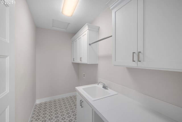 17716 NW Layla Dr Lot 28, Portland, OR 97229 - washroom with baseboards, light flooring, cabinet space, and attic access