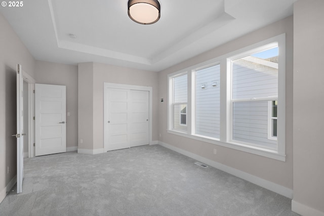 17716 NW Layla Dr Lot 28, Portland, OR 97229 - unfurnished bedroom with a raised ceiling, carpet flooring, a closet, and baseboards