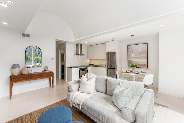 859 SW Broadway Dr Unit 41, Portland, OR 97201 - living area featuring visible vents, recessed lighting, vaulted ceiling, and light wood-type flooring