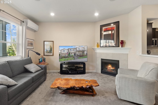 carpeted living area featuring recessed lighting, baseboards, a tiled fireplace, and a wall mounted air conditioner