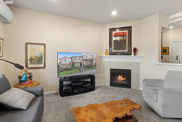 living area with carpet, recessed lighting, a tiled fireplace, an AC wall unit, and baseboards