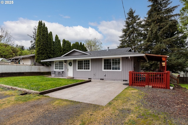 view of front facade with crawl space, driveway, roof with shingles, fence, and a front lawn