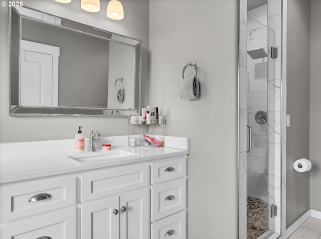 196 Dylan Ct, Gearhart, OR 97138 - bathroom featuring a shower stall, vanity, and marble look tile flooring