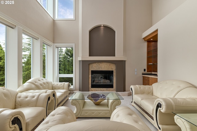 16215 SE Rivershore Dr, Vancouver, WA 98683 - living area featuring a towering ceiling, healthy amount of natural light, and a tiled fireplace