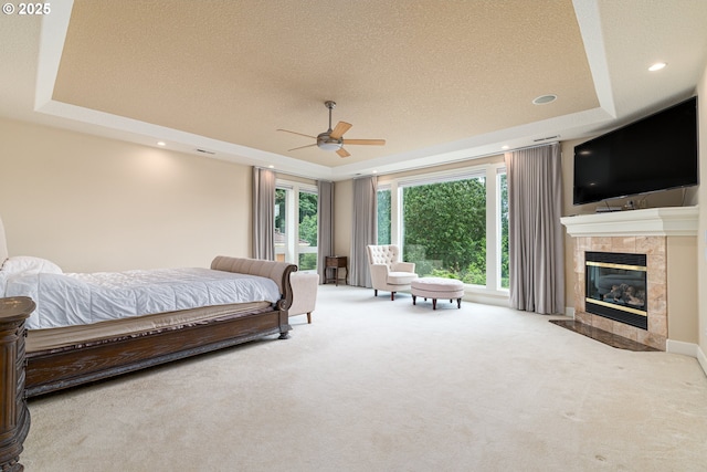 16215 SE Rivershore Dr, Vancouver, WA 98683 - bedroom featuring a raised ceiling, carpet, a tile fireplace, a textured ceiling, and recessed lighting