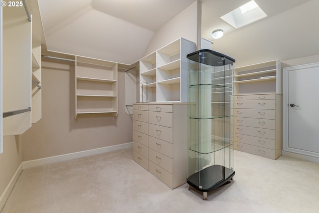 16215 SE Rivershore Dr, Vancouver, WA 98683 - walk in closet featuring a skylight, light carpet, and vaulted ceiling