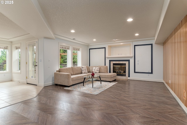16215 SE Rivershore Dr, Vancouver, WA 98683 - living area with baseboards, a textured ceiling, recessed lighting, and a tiled fireplace