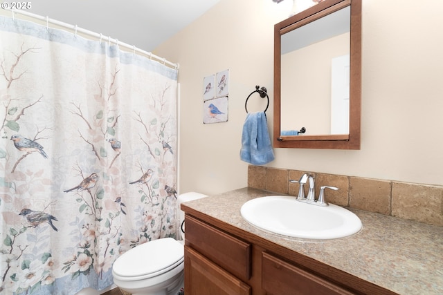 full bathroom with toilet, vanity, and a shower with shower curtain