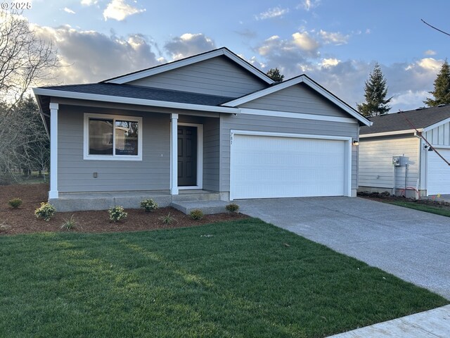 single story home with a front lawn and a garage