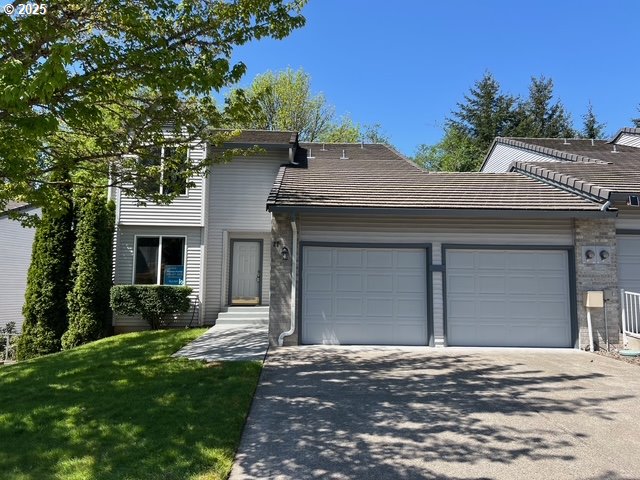 2217 NE 179th St Unit 22, Ridgefield, WA 98642 - traditional-style home with an attached garage, aphalt driveway, and a front yard