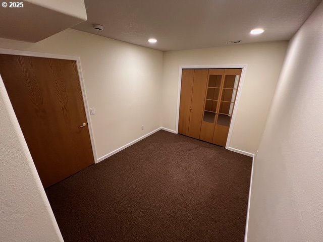 2217 NE 179th St Unit 22, Ridgefield, WA 98642 - unfurnished room with recessed lighting, baseboards, visible vents, and dark carpet