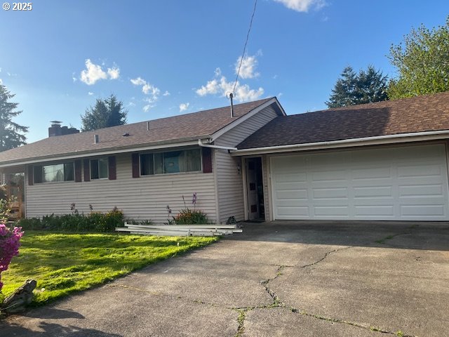 13727 SE Raymond St, Portland, OR 97236 - single story home with a garage, asphalt driveway, a chimney, and a front yard