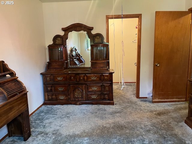 13727 SE Raymond St, Portland, OR 97236 - carpeted bedroom featuring baseboards