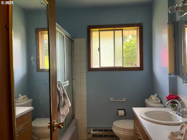 13727 SE Raymond St, Portland, OR 97236 - full bathroom with toilet, vanity, and a baseboard radiator