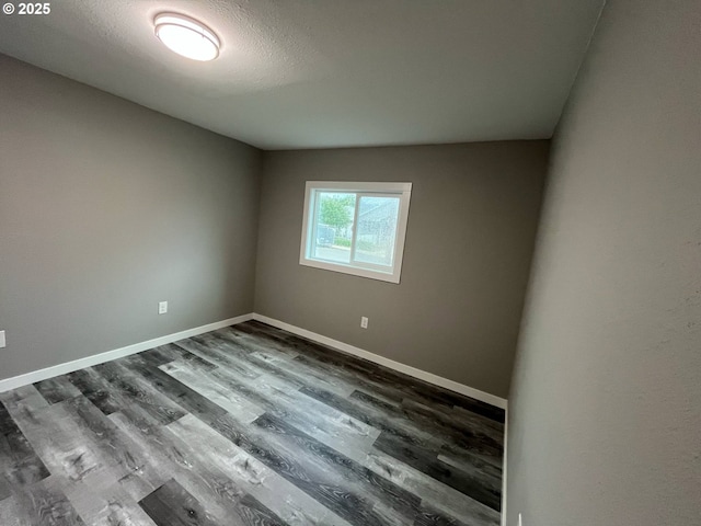 441 NE Johnson St, Myrtle Creek, OR 97457 - spare room with dark wood-style flooring and baseboards