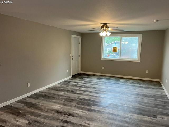 441 NE Johnson St, Myrtle Creek, OR 97457 - spare room featuring a ceiling fan, baseboards, and dark wood-style floors