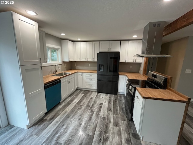 441 NE Johnson St, Myrtle Creek, OR 97457 - kitchen featuring black refrigerator with ice dispenser, butcher block counters, dishwasher, stainless steel electric range oven, and island exhaust hood